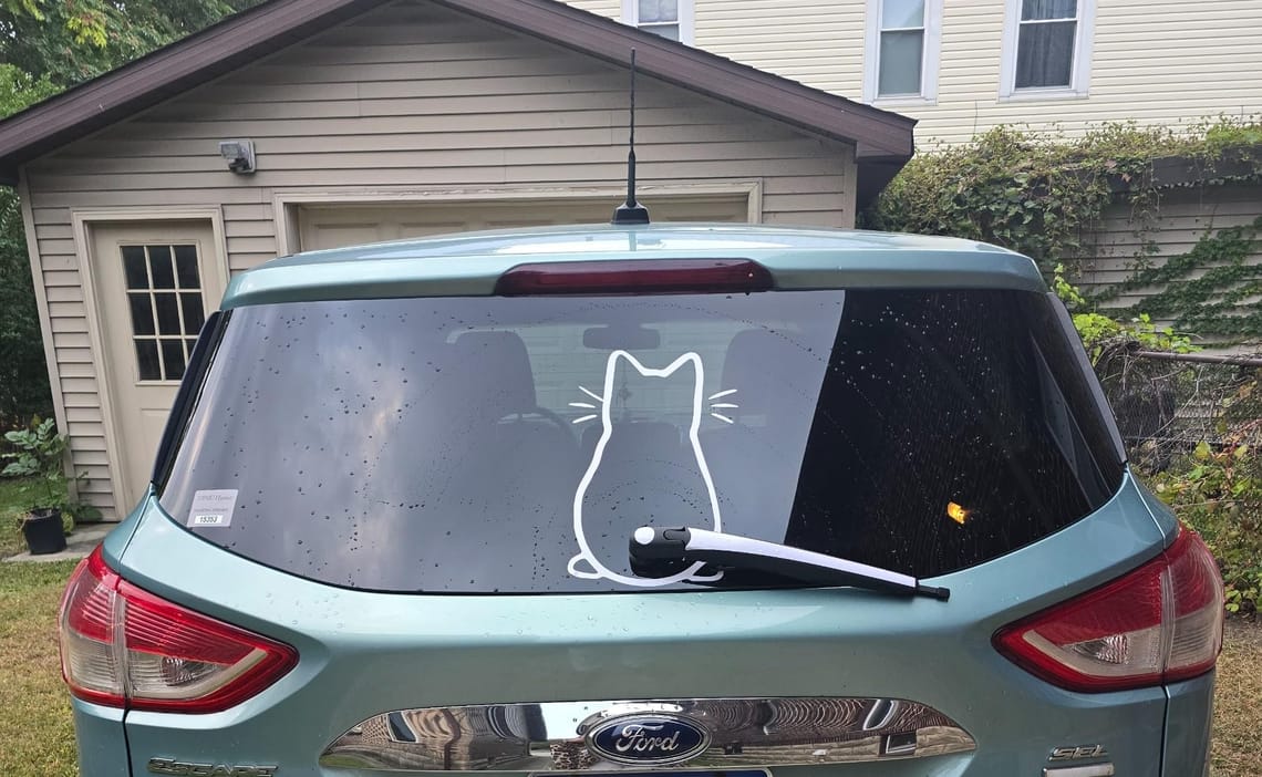 This Waving Cat Sticker Made My Boring Car Fun Again